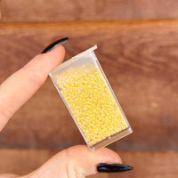 11/0 Light Yellow Lined Crystal AB