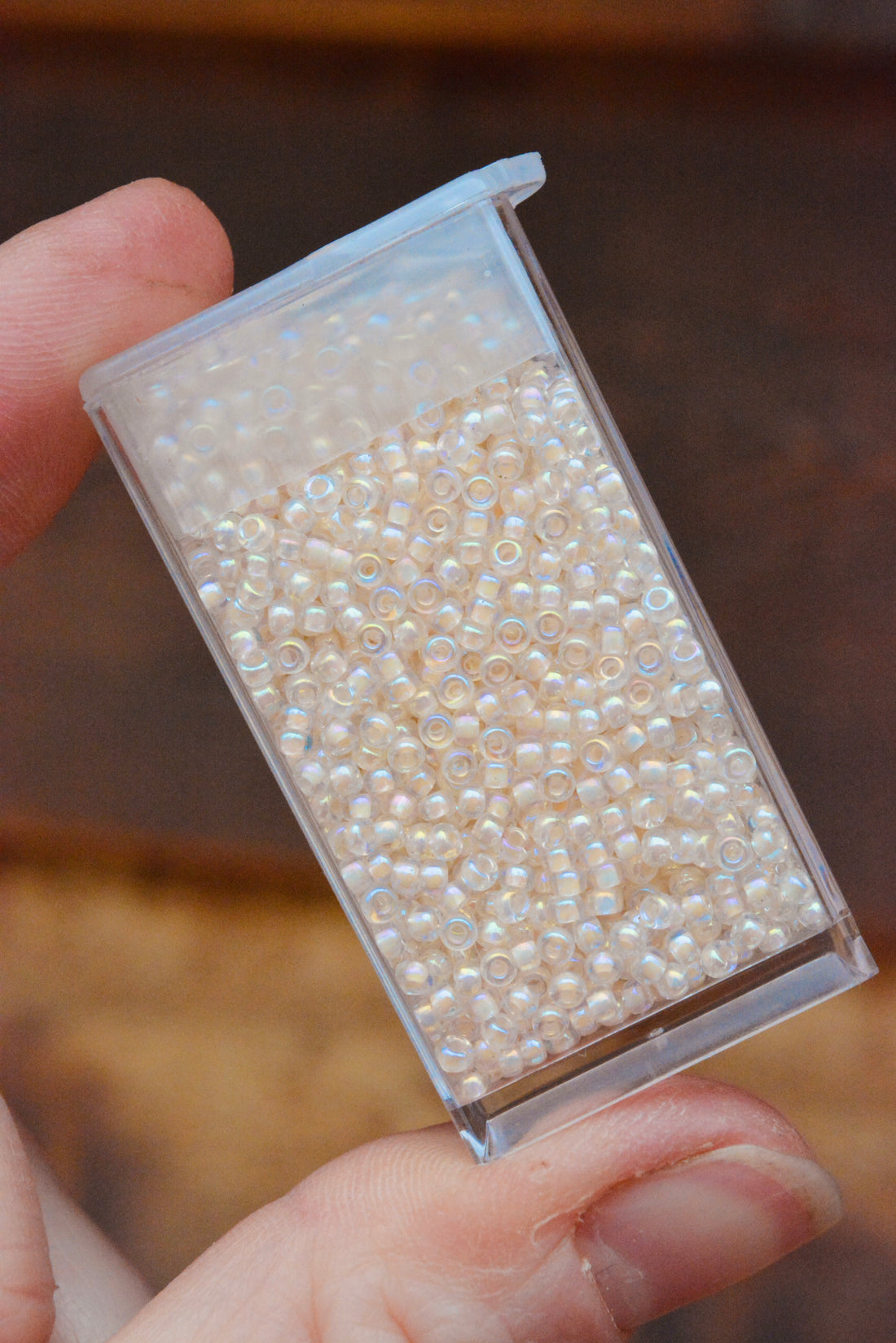 11/0 Pale Peach Lined Crystal AB
